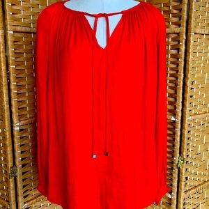 Jennifer Lopez red blouse